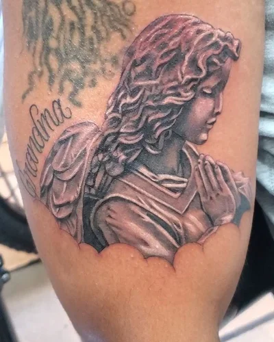 The name is 'Suitedreamztattoo' tattoo 034